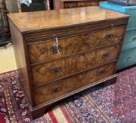 A Queen Anne Revival walnut three drawer chest with slide, width 108cm, depth 54cm, height 86cm