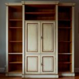 A reproduction Continental painted breakfront bookcase / media cabinet, width 204cm, depth 55cm,