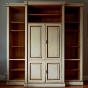 A reproduction Continental painted breakfront bookcase / media cabinet, width 204cm, depth 55cm,