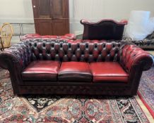 A Thomas Lloyd buttoned burgundy leather Chesterfield sofa, length 200cm, depth 85cm, height 72cm,