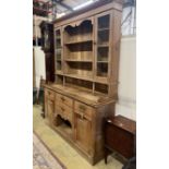 An early 20th century bleached oak dresser, width 165cm, depth 48cm, height 223cm