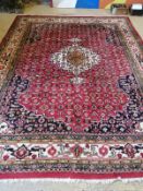 A North West Persian red ground carpet, 350cm x 260cm