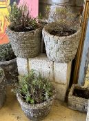 Three circular reconstituted stone garden planters, largest diameter 28cm, height 25cm