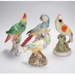 A group of twelve ceramic parrots including one by S Hancock & Sons, largest 24cm high