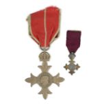 A cased George V military MBE containing leaflet with instructions as to wearing Insignia,