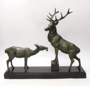 After Louis-Albert Carvin (1875–1951). A spelter group of a stag and faun, signed to base. 41cm