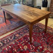 A 19th century French cherry farmhouse table with single extension on square tapered legs, width