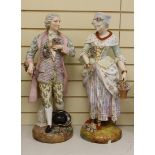 A pair of massive German porcelain figures of flower sellers, late 19th century, 66.5cm