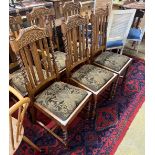 A set of six 1920's oak barley twist dining chairs, two with arms