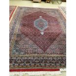 A Bidjar red ground carpet, 330cm x 223 cm