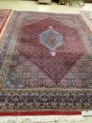 A Bidjar red ground carpet, 330cm x 223 cm