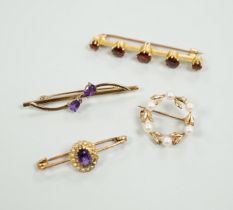 A 15ct and graduated five stone garnet set bar brooch, 48mm, a similar amethyst and seed pearl