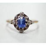 An early 20th century yellow metal, sapphire and diamond cluster set oval cluster ring, size R/S,