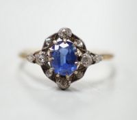 An early 20th century yellow metal, sapphire and diamond cluster set oval cluster ring, size R/S,