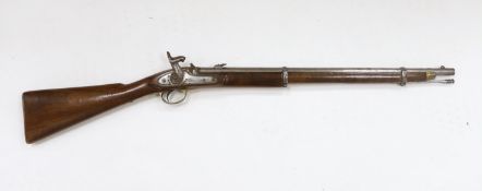 A two band percussion Military carbine of Indian use, regulation brass mounts, fold leaf rear sight,