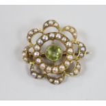 A late Victorian 15ct peridot and seed pearl set cluster brooch, 21mm, gross weight 3 grams.