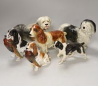 A group of six ceramic models of dogs including Royal Doulton and Beswick