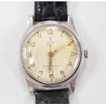 A gentleman's stainless steel Tudor Royal manual wind wrist watch, on associated leather strap, case