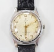 A gentleman's stainless steel Tudor Royal manual wind wrist watch, on associated leather strap, case