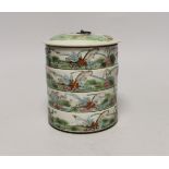 An early 20th century Chinese enamelled porcelain four section stacking food container and cover,