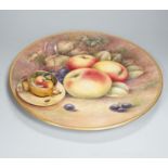 A large fruit painted dish by R. Budd and a Royal Worcester fruit painted miniature tea cup and