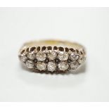 An 18ct and two row diamond cluster set half hoop ring, size R, gross weight 4.6 grams.