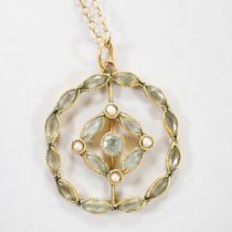 An Edwardian 9ct, aquamarine? and seed pearl set circular cluster pendant necklace, overall 48cm,