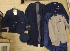 A collection of post-war RAF uniforms, comprising; two caps, double-breasted overcoat, dress uniform