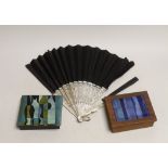 A mother of pearl guard fan and two enamel topped boxes, largest enamel topped box 12.5cm x 10cm