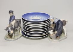 A pair of Royal Copenhagen porcelain figures and assorted commemorative plates, tallest figure