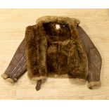 A WWII Air Ministry issue RAF sheepskin flying jacket, with original label stating; ‘AM Contract