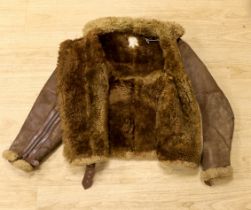 A WWII Air Ministry issue RAF sheepskin flying jacket, with original label stating; ‘AM Contract