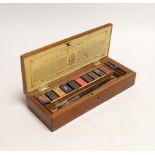 A Charles Roberson mahogany cased watercolourist's paints