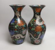 A pair of Japanese black ground ‘dragon’ vases, 37cm