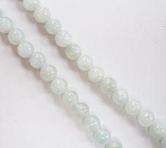 A single strand jadeite bead necklace, with 18k clasp, 43cm, gross weight 58.7 grams, with