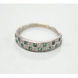 A modern 18ct white gold and two row emerald and diamond cluster set half hoop ring, size S, gross