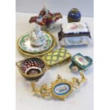 A collection of European porcelain and glass, including lidded boxes, ormolu mounted glass plates,