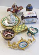 A collection of European porcelain and glass, including lidded boxes, ormolu mounted glass plates,