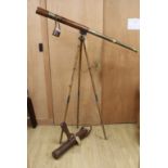 A WWI leather cased telescope and tripod, 57cm