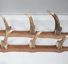 A two piece antler gun rack, 87cm high