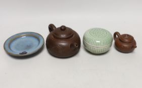 Two Yixing teapots, a celadon glazed circular box and Jun type saucer, 12cm diameter