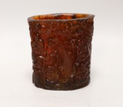 A Chinese amber coloured moulded plastic brush pot, 13.5cm