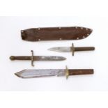 A Bowie knife with wooden grip, in a leather sleeve, blade etched with ‘Siege of The Alamo 1836 Col.