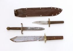 A Bowie knife with wooden grip, in a leather sleeve, blade etched with ‘Siege of The Alamo 1836 Col.