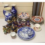 A collection of Chinese and Japanese pottery and porcelain including three vases, five figures,