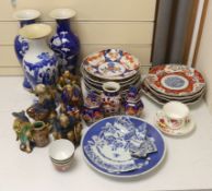 A collection of Chinese and Japanese pottery and porcelain including three vases, five figures,