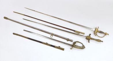 Three 20th century short swords; a court sword in a leather scabbard, a naval style sword, plus
