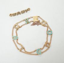 An Edwardian 15ct?, turquoise and seed pearl set 'Good Luck' chain bracelet, 17cm and a yellow metal