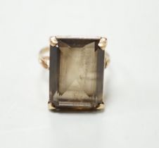 A 9ct gold and single stone smoky quartz set dress ring, size T, gross weight 8.5 grams.