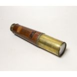 A WWI three draw brass telescope with sun shade and leather outer cover by Taylor Taylor Hobson